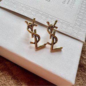 YSL Logo Antique Gold Stud Earrings
